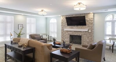 Cozy common area with comfortable seating and a fireplace