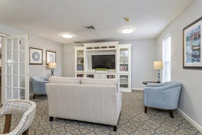 Cozy common area with seating and entertainment center