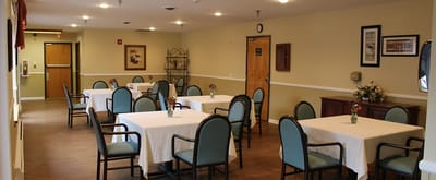 Interior of a dining room with tables and chairs
