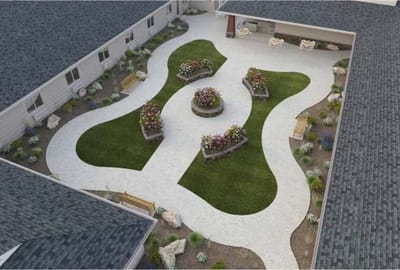 Aerial view of a landscaped courtyard with flower beds