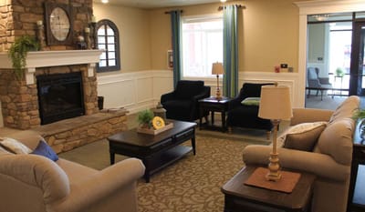 Cozy common area with seating and a fireplace