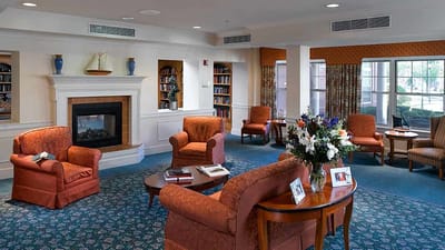 Interior common area with a fireplace and seating