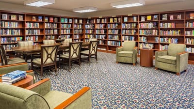 Cozy library with seating and bookshelves