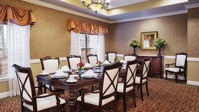 Elegant dining room with a large table and floral decorations