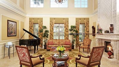 Elegant interior common area with piano and seating