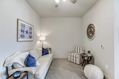 Stylish interior living room with sofa and clock