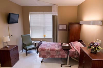 Private resident room with a bed and furniture