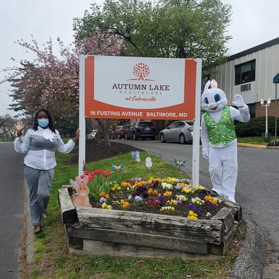 Sign outside Autumn Lake with staff and Easter Bunny.