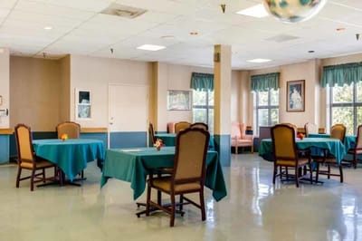 Autumn Lake Healthcare at Glen Burnie, Nursing Home in Glen Burnie, MD — Dining area with tables and chairs in bright lighting