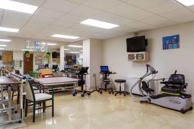 Interior view of a physical therapy area with equipment