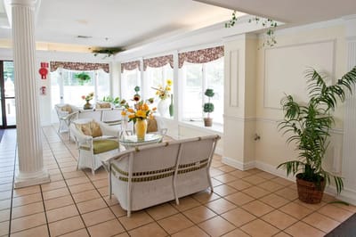 Bright lobby area with seating and plants
