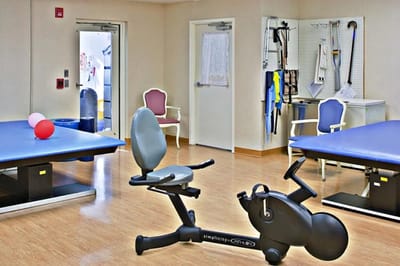 Interior room with exercise equipment and seating