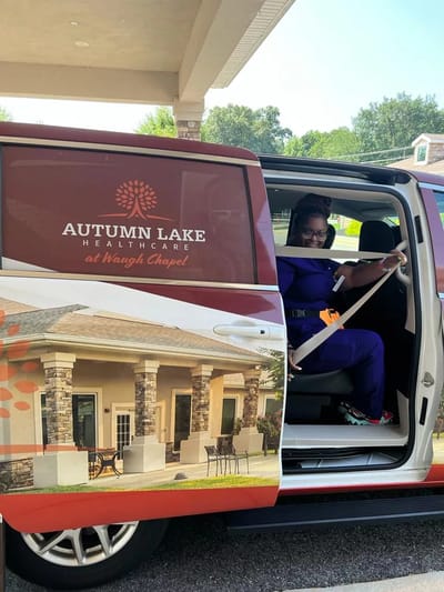 Staff member in vehicle of Autumn Lake Healthcare