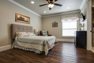 Cozy private resident room with a bed and seating area