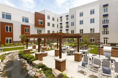 Outdoor patio area with seating and landscaping