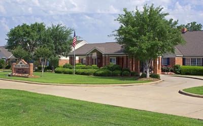 Exterior view of Azalea Estates of Monroe with landscaping
