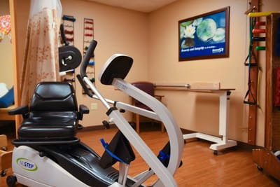 Well-equipped therapy room with exercise equipment