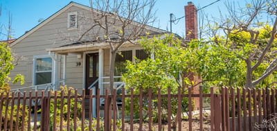 Exterior view of a residential style building with trees