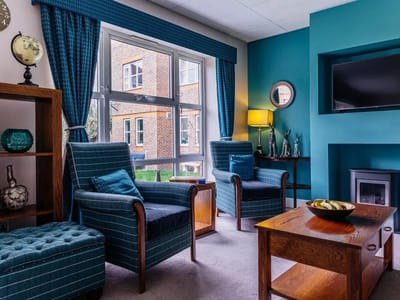 Cozy common area with comfortable seating and blue decor
