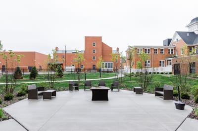 Outdoor space with seating and greenery