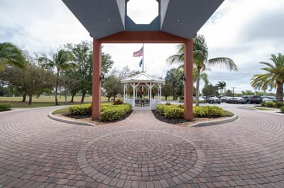 Exterior view of the facility entrance with a gazebo