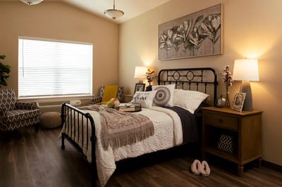 Cozy bedroom setup with floral decor and bedding