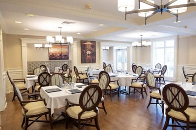 Elegant dining room with round tables and chairs