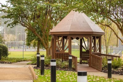 A gazebo in a landscaped outdoor area