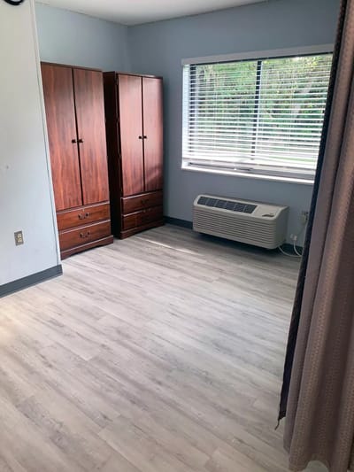 Empty resident room with wooden furniture