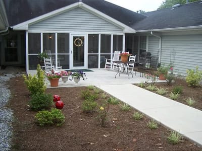 Patio area with seating and garden flowers