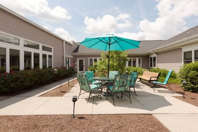 Outdoor seating area with colorful umbrellas and plants