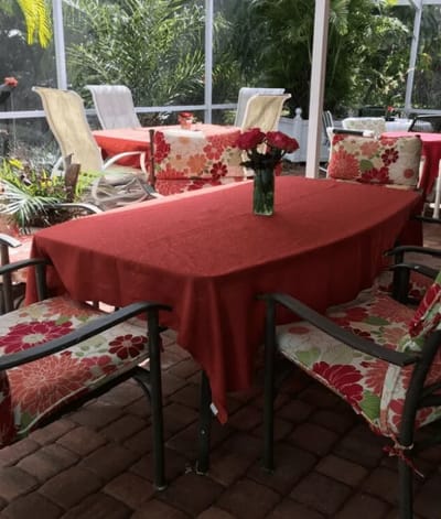 Outdoor dining area with floral decor and tables