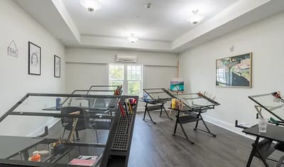 Art room with easels and painting supplies