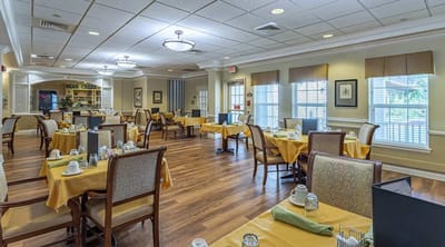 Dining room with tables set for residents