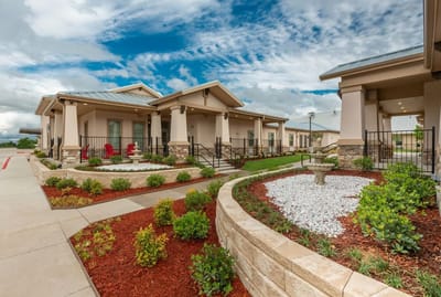 Exterior view of BeeHive Homes showcasing landscaped front area