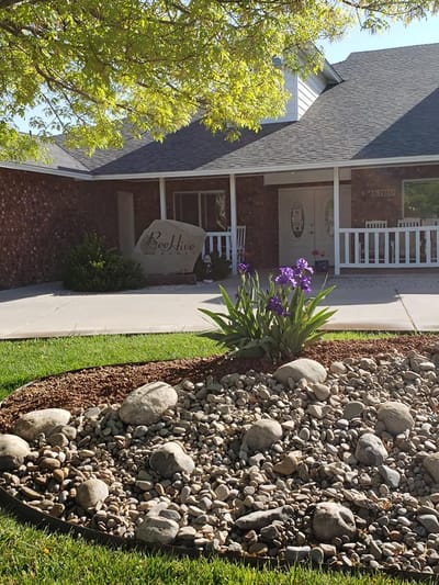 Exterior view of a senior living facility with landscaping