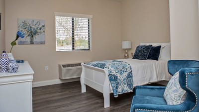 Cozy interior of a resident's room with blue decor