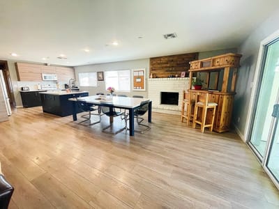 Bright common area with dining table and kitchenette