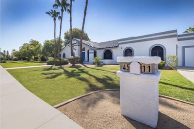 Exterior view of a senior living facility with landscaping