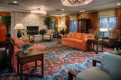 Bright common area with colorful seating and decor
