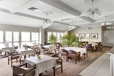 Elegant dining area with tables and chairs