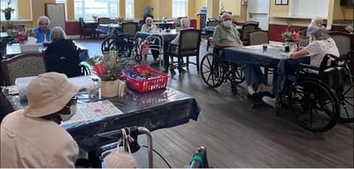 Residents participating in a bingo game in a common area