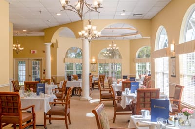 Elegant dining room with tables set for meals