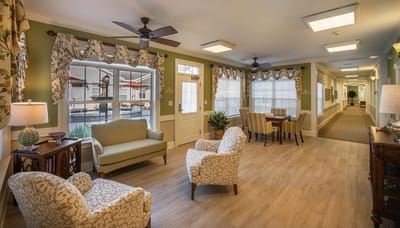 Bright common area with seating and natural light