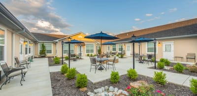 Outdoor patio area with seating and umbrellas
