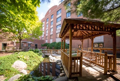 A gazebo in a landscaped garden area