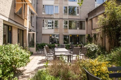 Outdoor courtyard with seating and greenery