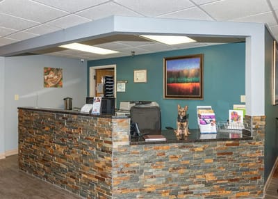 Reception area of a senior living facility with a dog.