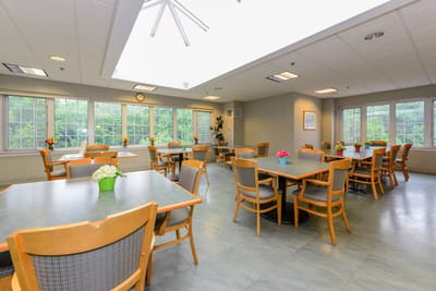 Bright common area with tables and chairs