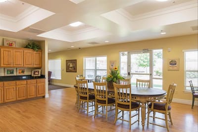 Bright dining area with large table and windows